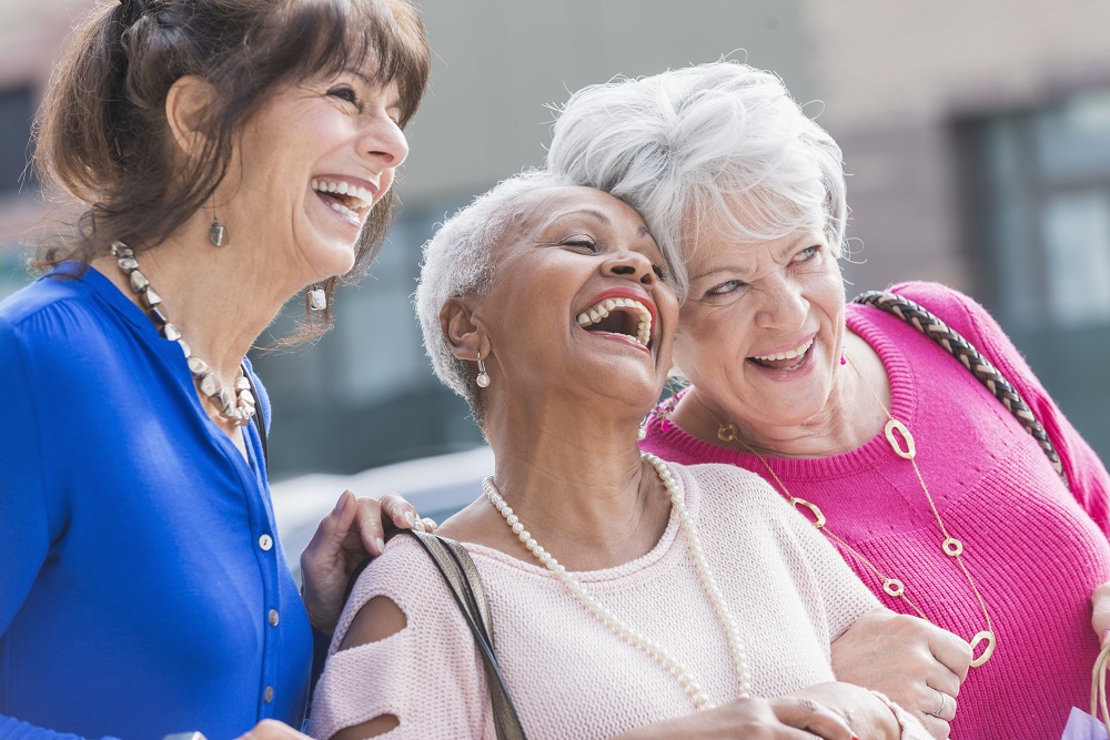 Three older women friends enjoying a shopping trip