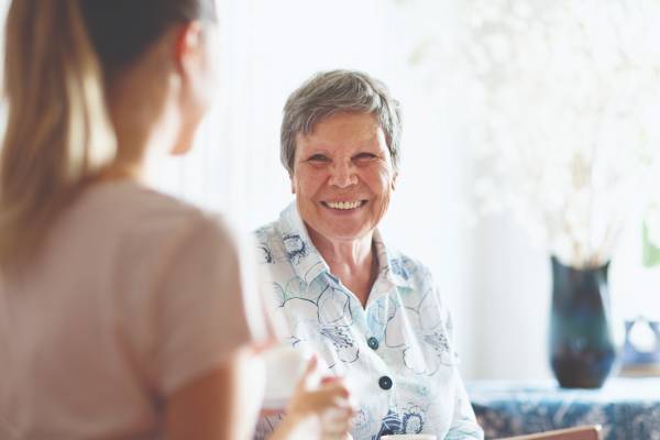 Senior woman talking with another woman